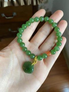 李女士戴和田玉碧玉手链惊艳茶会